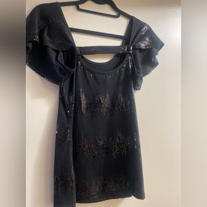 Black figure flattering top with sequence detail and cute fluttery sleeves